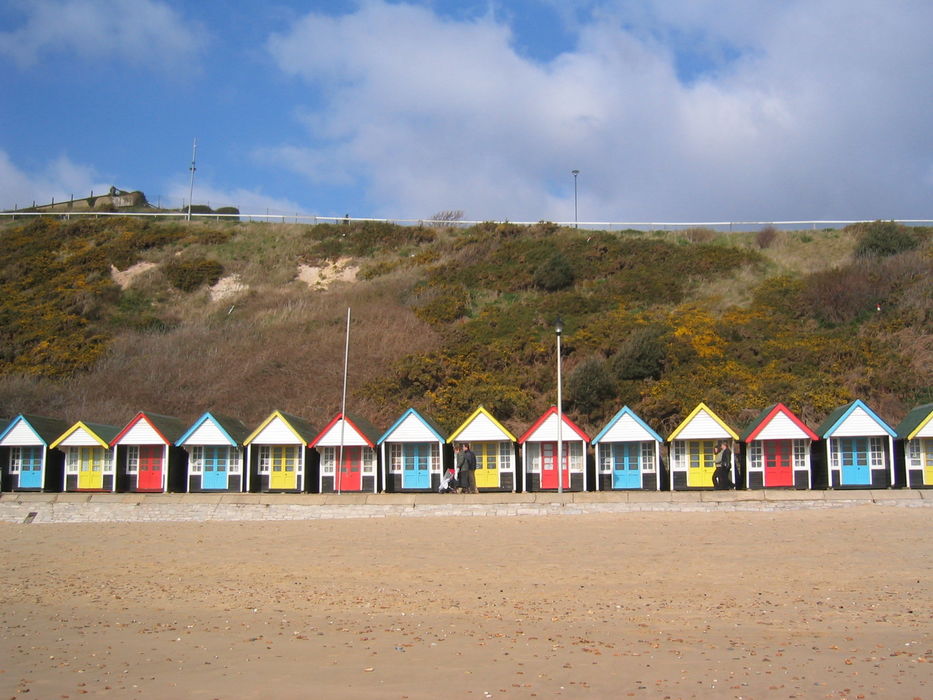 Colourful beach huts from the beach at Bournemouth
 #moremoneythansense #beachhutrows #hutrows