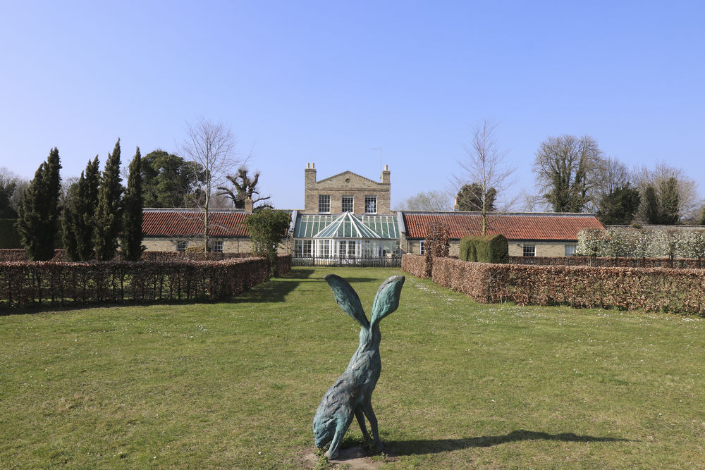 The hare has the best view of the gardens in this shot of the conservatory at Chippenham
 #gardenhare #alerthare #chippenhamhare #bronzehare