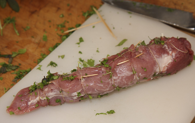 Apricot stuffed pork fillet sewn up.jpg.