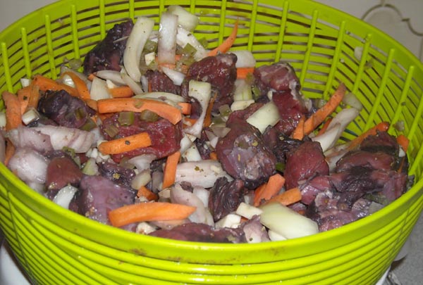 Draining the meat and vegetables in a salad spinner.jpg.