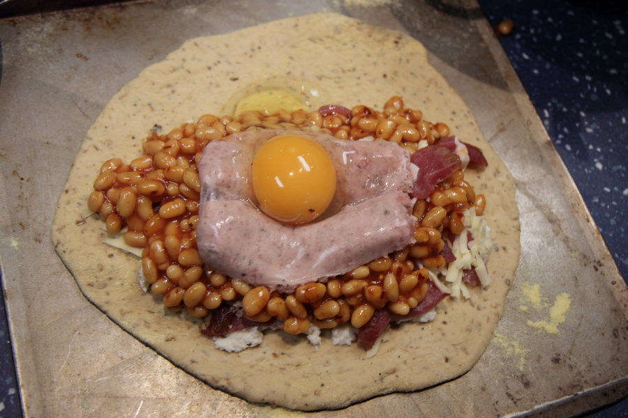 Baked bean sausage bacon egg pizza ready to fold.jpg.