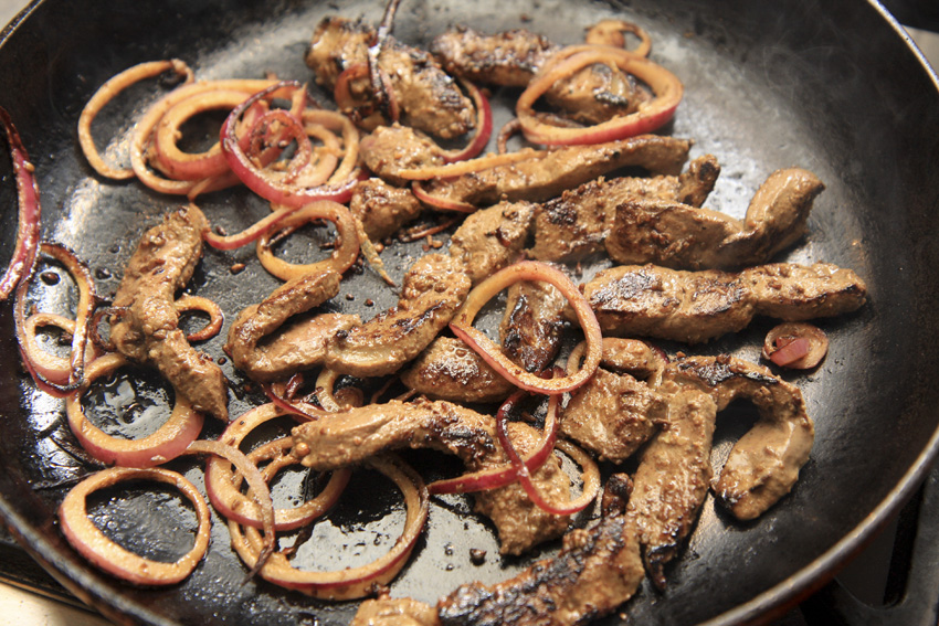 Hugh's merguez liver and onions frying.jpg.
