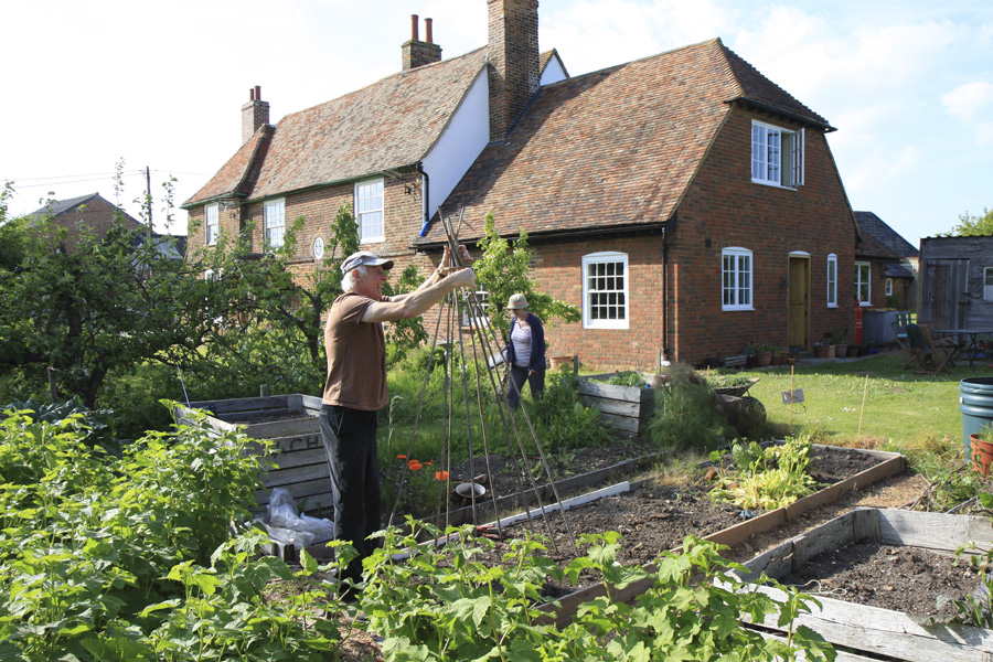 Jan and Vic Rudolph gardening.jpg.