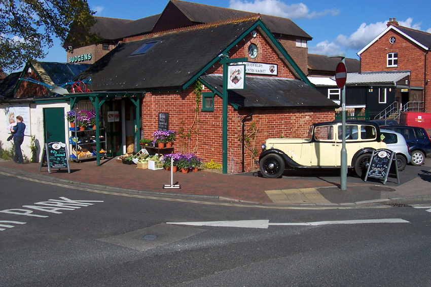Outside Burdfields Country Market with old Austin car.jpg.