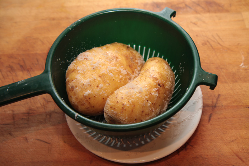 Baked potatoes salting.jpg.