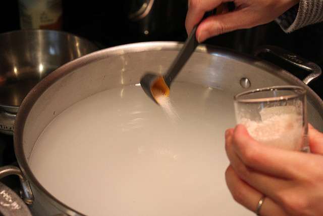 Adding pink salt to a brine solution.jpg. Adding pink salt to a brine solution.jpg.