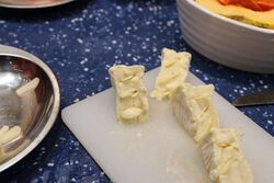 Camembert quarters filled with garlic slices