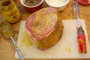 Coated with English mustard , salt and pepper