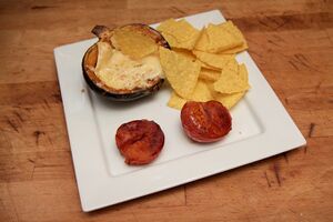 Baked squash filled with melted Camembert cheese