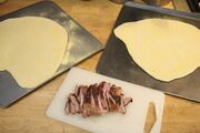One breast, two pizzas