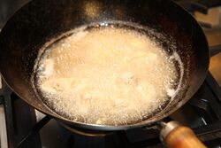 Frying in a wok