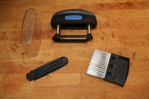 Jaccard meat tenderiser dismantled into its component pieces
