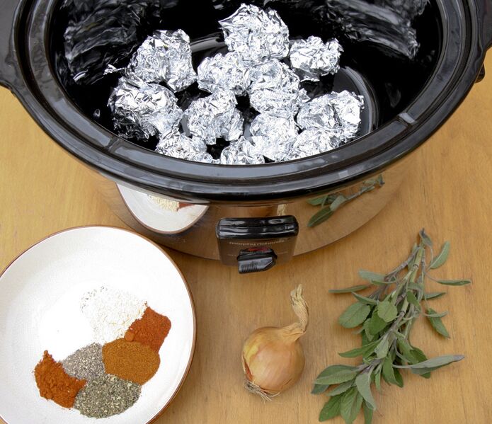 File:Roasting a chicken in a slow cooker - tin foil, rub and stuffing.jpg