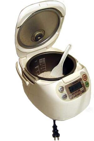 https://www.cookipedia.co.uk/wiki/images/thumb/4/48/Electronic_rice_cooker_with_scoop.jpg/300px-Electronic_rice_cooker_with_scoop.jpg