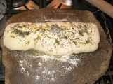 Focaccia Stromboli - rolled, ready for the oven on a hot pizza stone