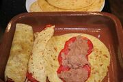 Fill each tortilla with chorizo and refried beans