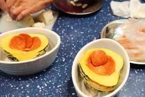 Line the halved squashes with pepperoni slices