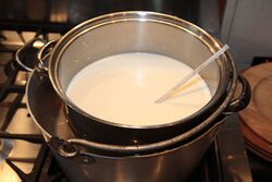 Use a double boiler so you don't scald the milk