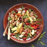 Grilled sausage and halloumi salad with avocados