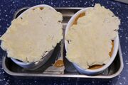 Covered with suet crumble, ready to bake
