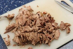 Duck breast chopped and shredded ready to serve