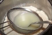 Press the sieve down and drain with a ladle