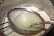 Press the sieve down and drain with a ladle