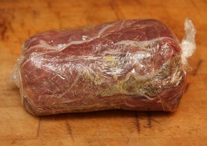 Parma ham, duxelles, mustard and beef fillet, wrapped up in cling film