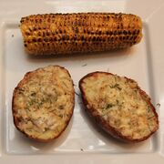 Cheesy monkfish jacket potatoes