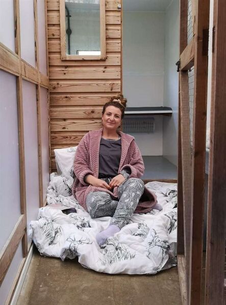 File:Leah Snowden in cat pen.jpg