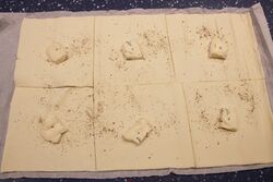 A dob of Cambazola on each square of puff pastry