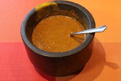 Vinegar added to the powdered spices