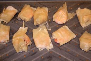 Filo pastry wrapped king prawns, ready to bake