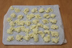 Frozen garlic on a paper-lined oven tray
