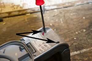 Remove large Torx retaining screws, arrowed]]