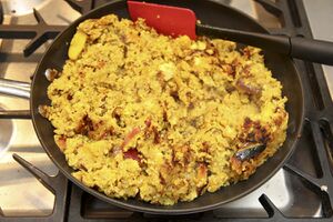 Frying the rice cake - keep turning it so you get lots of crunchy surfaces