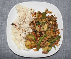 Spicy pork with peanuts, lime and basil