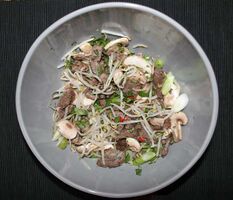 Seared beef and bean sprouts in spicy lime dressing