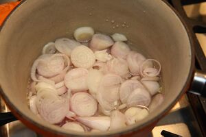 Half cover the shallots with water